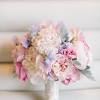 Vintage lilac ' amnesia' roses with cream roses and white vintage pastel bridal bouquet with 'juliette' garden roses, pink spray roses, light blue delphinium and white stock. 1