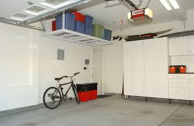 Overhead garage storage opens up much more usable space, especially for items not often used, by essentially using the ceiling as extra floor space. 13 Brilliant Ways Installing Overhead Garage Storage