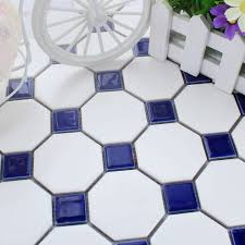 The most common way of laying out square or rectangular floor tiles is in a simple grid pattern where the edge of the grid lines up to the walls. Navy Blue Diamond And White Floor Tiles Google Search White Bathroom Tiles Bathroom Floor Tiles Tile Bathroom