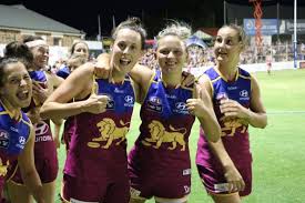 Lastair lynch for the lions celebrates with the trophy after. Brisbane Lions Womens Players Celebrate Win Over Adelaide Abc News Australian Broadcasting Corporation