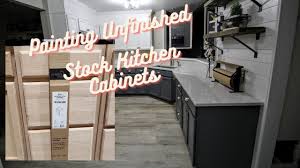 This opaque stain will cover up imperfections while protecting the wood against further damage. Kitchen Remodel How To Paint Unfinished Lowes Stock Cabinets Youtube