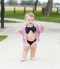 Woman in striped bathing suit sitting on stump. 900 Kids Ideas In 2021 Cute Kids Beautiful Children Beautiful Babies