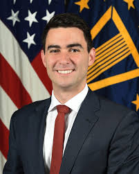 Dr. Matthew Daniels > U.S. Department of War > Biography