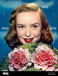 Actress with flowers hi-res stock photography and images