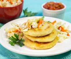 El salvador flag on fresh vegetables and plate of salvadoran enchiladas on background. Pupusas De Queso El Salvadoran Cheese Stuffed Tortillas Curious Cuisiniere