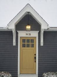 Gray house with yellow door. 30 Flawless Exterior House Paint Ideas With Yellow Colors Coodecor House Paint Exterior Exterior House Colors Cape Cod House Exterior