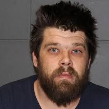 Wodonga man Scott Andrew Merrick became enraged when his girlfriend's  neighbour, armed with a baseball bat, began filming him