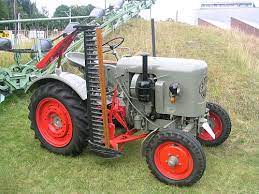 A lawn mower powered by a gasoline motor. Mower Italiano Meaning Of Mower
