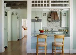 A half wall with top in an eclectic dining room and kitchen. Open Kitchen Layouts Better Homes Gardens