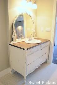 Making a a custom bathroom vanity from old furniture is easier than you think. Antique Dresser Turned Bathroom Vanity And Bathroom Sneak Peak Diy Bathroom Vanity Shabby Chic Bathroom Diy Bathroom