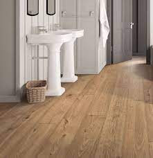 The crest ridge hickory is a great option if your looking for a farmhouse/rustic and even beachy vibe. Pergo Timbercraft Wetprotect Brier Creek Oak Laminate Flooring Pergo Flooring Rustic Flooring Flooring Cost Modern Flooring