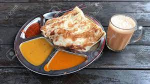 For back to reality on the commodore 64, a gamefaqs message board topic titled roti canai. Roti Canai Mit Dhal Curry Und Der Rostigen Holzernen Tabelle Teh Tarik Om Lokalisiert Indisches Und Asiatisches Essen Lizenzfreie Fotos Bilder Und Stock Fotografie Image 87150945