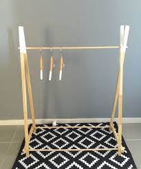 We did a teepee style of rack. Handmade Children Wooden Clothing Rack Timber Clothes Stand Nursery Decor Child Wood Clothing Rack Kids Clothing Rack Casual Decor
