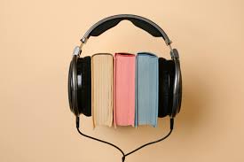 Black Corded Headphones with Colorful Books in Between · Free Stock Photo