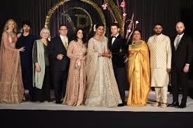 Priyanka Chopra Shares Her And Nick Jonas Full Family Wedding Portraits Family Wedding Photos Curvy Bridesmaid Dresses Wedding Outfits For Family Members