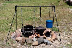 Perfect portable campfire grills with a raised edge, keeping the food on the grill, right up to the edge, without the food falling off. Folding Campfire Dutch Oven Cooking Grill