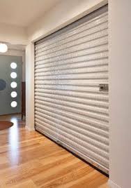 Janus Roll Up Door Used As Bedroom Closet Door Roll Up Doors Closet Doors Home