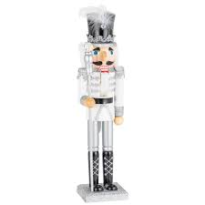 Made of cold cast resin, it measures 3 3/4 inches long, 6 inches tall, and 2 1/4 inches wide. Silver And White Nutcracker