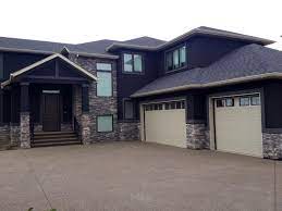 External blinds were used in the windows. Building New Homes In Central Alberta Brick Exterior House House Exterior Stucco Homes