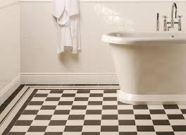This look is especially good for small bathrooms, where the scheme injects plenty of personality without overwhelming the space. View Tiles By Type Black And White Bathroom Floor Bathroom Floor Tiles Bathroom Floor Tile Patterns