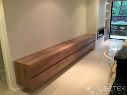 Custom Living Room Storage These Wall Hung Units Are Made In Polytec Sepia Oak Which Gives Wall Cabinets Living Room Shelving Units Living Room Living Room Tv