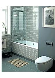 The clear tempered glass is layered with sleek stainless steel hardware, making it look unique and modern in the bathroom space. Modern Bath Shower Combinations Bathroom Style Interior Good Tub Looking Bathtub Combo Design Ideas Bathtub Remodel Modern Bathroom Design Bathtub Shower Combo