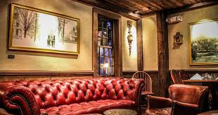 Oxblood Leather Sofa In The Tavern Lounge Area At The Farm Table Restaurant Bernardston Ma Farm Table Farm Table Restaurant White Marble Bar