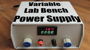 A wood enclosure is built, and adafruit's mini volt meter, v out posts, and a potentiometer are mounted in the final product. Build Your Own Variable Lab Bench Power Supply Youtube