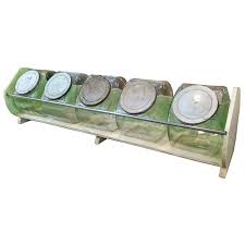 Glass candy jar from roetell factory. Original Vintage Convenience Store Display For Five Glass Candy Jars With Lids At 1stdibs