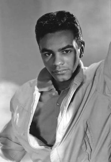 Singer, songwriter Johnny Mathis, circa 1958 photo by Harry Hammond. Mathis started his career with singles, then becoming highly popular as an album artist with several dozen of his albums achieving gold
