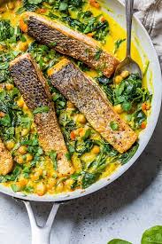 Seared Salmon With Spinach And Chickpeas In A Creamy Coconut Curry Sauce Is An Easy One Pot Meal That In 2021 Healthy Eating Recipes Curry Recipes Skinny Taste Recipes