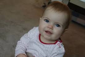 Miracle baby born with bowel OUTSIDE her body defies the odds to celebrate  first birthday