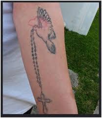 Check spelling or type a new query. Dove And Rosary Tattoo On Forearm Entertainmentmesh