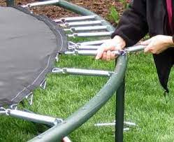 Pull them over a dowel and insert the dowel just above the bottom hole of the drop side rail. How To Set Up A Trampoline Easy Steps Gettrampoline Com