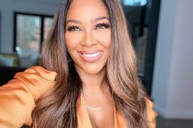 Kenya Moore Body Transformation Fitted Brown Leather Dress