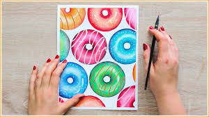 Do you love watercolor painting but are blanking on what to paint? Easy Watercolor Painting Ideas How To Paint Donuts With Watercolors