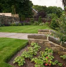 Sloping Garden Ideas 5 Things To Consider Terraces Levelling Consider the granite (slabs or setts) with a flamed texture.