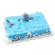 This delicious 1/4 sheet cake is made with a moist chocolate cake layer, iced in a traditional buttercreme icing, garnished with a mixture of white crushed curls and chocolate cake crumbs, topped with a chocolate briar rose and leaves. Shark Attack Sheet Cake Walmart Com Walmart Com