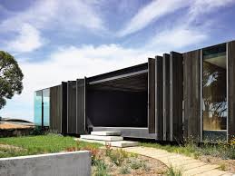 Emerging From Amongst Coastal Sheoaks And Banksias The Reflective Glass Facade Of The Bluff House By R Beach House Design Architecture Australian Architecture