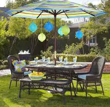 Outdoor Patio Sets With Umbrella Using Rattan Table Set And Many Pendant Lamps Making Better Outdoor Patio S Patio Set With Umbrella Backyard Decor Patio Decor