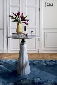 Paramount Marble Pedestal Table Pleated Cast Aluminum Lays A Textural Base For A Gorgeou In 2020 Marble Pedestal Table Furniture Dining Table Round Marble Dining Table
