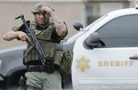 Man arrested in killing of 1 officer, wounding of another