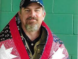 Steve Rollins receives Quilt of Valor from Gaylord Patriotic Quilters