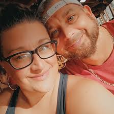 The woman said her husband won the lottery and had left her with the dogs:  https://thegeorgiagazette.com/featured/couple-charged-with-165-combined-counts-of-animal-cruelty-after-70-living-13-dead-dogs-found-on-property/