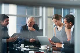 Group Of Corporate Business People Having A Meeting Stocksy United Business Man Photography Corporate Photography Corporate Portrait