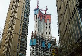 Due to airspace regulations, it will be redesigned so its height does not exceed 500 metres above sea level. Construction Wuhan Greenland Center