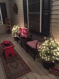 A Black Windsor Bench Makes An Old Fashioned Christmas Setting On The Front Porch Christmas Porch Decor Front Porch Christmas Decor Christmas Porch