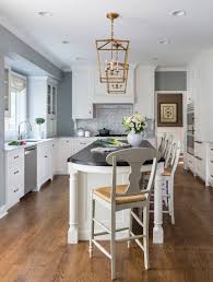 Most people want to incorporate seating on the island too, although that's not always a great fit with a cooktop if you have a more formal space. Island With Seating For 3 Kitchen Ideas Photos Houzz