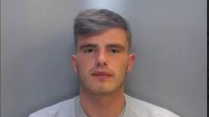 Son who 'hoyed' knife at man who was having sex with his mother jailed