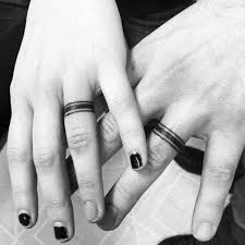Some tattoos appear on all your fingers like astrology tattoos or witch design tattoos. 60 Awesome Wedding Ring Tattoos Weddingomania